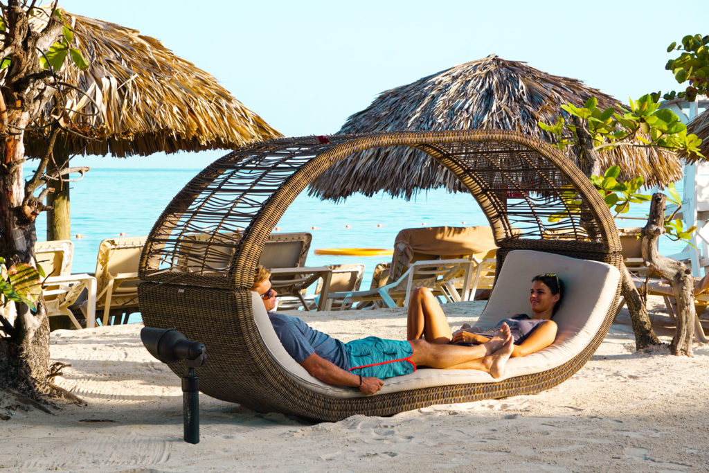 Chilling in one of the couples beach chairs at Sandals Montego bay, a luxury all inclusive vacation experience